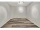 A well-lit room featuring wood-look flooring and neutral walls, ready for personalization and flexible use at 3870 Island Way, St Petersburg, FL 33705
