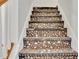 Staircase showcasing mosaic tile steps for added character at 3870 Island Way, St Petersburg, FL 33705