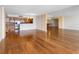 Wood-floored living room with open floorplan features a well lit, modern kitchen at 400 Island Way # 911, Clearwater Beach, FL 33767