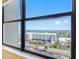 An interior view of the city as seen through a large window at 400 Island Way # 911, Clearwater Beach, FL 33767