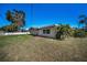 Charming home featuring a spacious backyard with lush green grass at 4191 39Th S St, St Petersburg, FL 33711