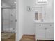 Bathroom with a glass-enclosed shower and a single sink vanity at 4191 39Th S St, St Petersburg, FL 33711