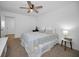 Comfortable bedroom boasts white walls, ceiling fan, and calming natural light at 4191 39Th S St, St Petersburg, FL 33711