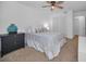 Bright bedroom features a ceiling fan, closet, and calming decor at 4191 39Th S St, St Petersburg, FL 33711