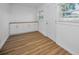Bonus room featuring lots of natural light, built in cabinetry, and wood-look flooring at 4191 39Th S St, St Petersburg, FL 33711