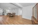 Open-concept dining and kitchen area with hardwood floors and contemporary lighting at 4191 39Th S St, St Petersburg, FL 33711