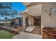 Welcoming front porch with tiled flooring, brick accents, and stylish landscaping at 4191 39Th S St, St Petersburg, FL 33711