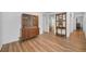 Inviting hallway with updated hardwood flooring, decorative shelving, and ample natural light at 4191 39Th S St, St Petersburg, FL 33711
