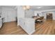 Open-concept kitchen with island bar seating, stainless steel appliances, and access to dining area at 4191 39Th S St, St Petersburg, FL 33711