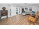 Spacious living room with wood floors, large windows, comfortable seating, and stylish decor at 4191 39Th S St, St Petersburg, FL 33711