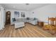 Bright living room with a comfortable sectional, rocking chair, wood floors and classic accents at 4191 39Th S St, St Petersburg, FL 33711