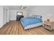 Airy main bedroom with sleek decor, wood-look floors, and a comfortable modern design at 4191 39Th S St, St Petersburg, FL 33711