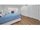Bright main bedroom features wood-look floors, closet, and ensuite bathroom at 4191 39Th S St, St Petersburg, FL 33711