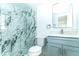 Modern bathroom with marble-look tiled shower, brushed nickel fixtures and updated vanity at 4222 Autumn Leaves Dr, Tampa, FL 33624