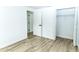 Neutral bedroom features wood-look floors, closet and an ensuite bathroom at 4222 Autumn Leaves Dr, Tampa, FL 33624