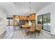 Bright kitchen and dining area featuring stainless steel appliances, granite countertops, and a center island at 4308 Grainary Ave, Tampa, FL 33624