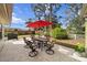 Backyard patio and BBQ with table and chairs, ideal for outdoor gatherings at 4407 Parnell Dr, Sarasota, FL 34232