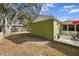 Exterior view of the backyard with the patio to the side at 4407 Parnell Dr, Sarasota, FL 34232