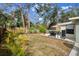 Spacious backyard with a grill and an umbrella, perfect for outdoor entertaining at 4407 Parnell Dr, Sarasota, FL 34232