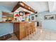 Unique bar area with wood accents, decorated with vintage signs and memorabilia, perfect for entertaining guests at 4407 Parnell Dr, Sarasota, FL 34232