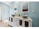 Bright bathroom with a modern double vanity, vessel sinks, and stylish fixtures at 4407 Parnell Dr, Sarasota, FL 34232