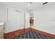 Cozy bedroom featuring hardwood floors and a closet, offering ample storage space at 4407 Parnell Dr, Sarasota, FL 34232