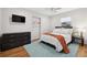 Inviting bedroom with modern furnishings, ceiling fan, and plush bed at 4407 Parnell Dr, Sarasota, FL 34232