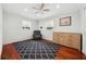 Bedroom featuring two windows with a dark patterned rug at 4407 Parnell Dr, Sarasota, FL 34232