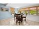 Cozy dining area bathed in sunlight, featuring windows and views of the outdoors, perfect for casual meals at 4407 Parnell Dr, Sarasota, FL 34232