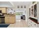 Open-concept kitchen and living area featuring tile floors and a blend of modern and classic decor at 4407 Parnell Dr, Sarasota, FL 34232