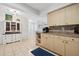 Open kitchen area featuring neutral cabinetry and decor, seamlessly connecting to adjacent spaces and cabinetry at 4407 Parnell Dr, Sarasota, FL 34232