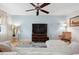 Relaxing living room with a modern ceiling fan, a mounted TV, and comfortable seating for entertainment at 4407 Parnell Dr, Sarasota, FL 34232