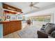 Open floor plan with a bar, dining area, and comfortable seating, bathed in natural light from large windows at 4407 Parnell Dr, Sarasota, FL 34232