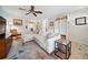 Inviting living space featuring a large sectional, a patterned rug, and stylish storage for a comfortable atmosphere at 4407 Parnell Dr, Sarasota, FL 34232