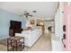 Bright living room featuring tile flooring, a comfortable sofa, and an open layout for modern living at 4407 Parnell Dr, Sarasota, FL 34232