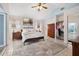 Bright and airy primary bedroom featuring a ceiling fan, a full closet and an ensuite bath at 4407 Parnell Dr, Sarasota, FL 34232
