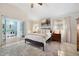 Bright and airy primary bedroom featuring a ceiling fan, a full closet and an ensuite bath at 4407 Parnell Dr, Sarasota, FL 34232