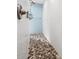 Elegant walk-in shower featuring pebble flooring and sleek, white subway tile walls at 4407 Parnell Dr, Sarasota, FL 34232