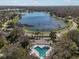 Stunning community pool, lake, and winding roads offering picturesque scenery at 4701 Marsh Hawk Ct, Valrico, FL 33596