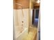 Bright bathroom features a tile shower over a tub and tan tile flooring at 5125 Palm Springs Blvd # 1101, Tampa, FL 33647