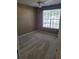The carpeted bedroom boasts a ceiling fan and a window with natural light at 5125 Palm Springs Blvd # 1101, Tampa, FL 33647
