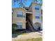 Exterior view of the building with stairs leading to the units, well maintained grounds at 5125 Palm Springs Blvd # 1101, Tampa, FL 33647