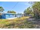 Spacious backyard with a wooden fence and mature trees at 5600 Bay Ne St, St Petersburg, FL 33703