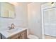 Bathroom features a modern vanity with sink, mirror, and a toilet at 5600 Bay Ne St, St Petersburg, FL 33703