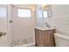 Updated bathroom with walk-in shower, modern vanity and sink, and toilet at 5600 Bay Ne St, St Petersburg, FL 33703