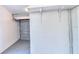 A single-car garage featuring a gray floor and door, and white walls at 5600 Bay Ne St, St Petersburg, FL 33703