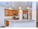 Well-equipped kitchen with stainless steel appliances, granite countertops, and pendant lighting at 5704 Kingletsound Pl, Lithia, FL 33547