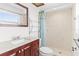 Bathroom featuring shower, vanity with granite countertop, and stylish fixtures at 5841 30Th N Ave, St Petersburg, FL 33710