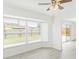 Bright living area with sliding glass doors and a ceiling fan at 5841 30Th N Ave, St Petersburg, FL 33710