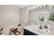 Well-lit bathroom featuring a large vanity, garden tub, and decorative accents at 585 Black Lion Ne Dr, St Petersburg, FL 33716